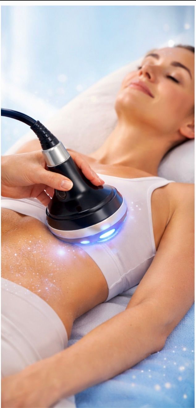 Woman receiving a body treatment with a handheld device. She is lying down with eyes closed.