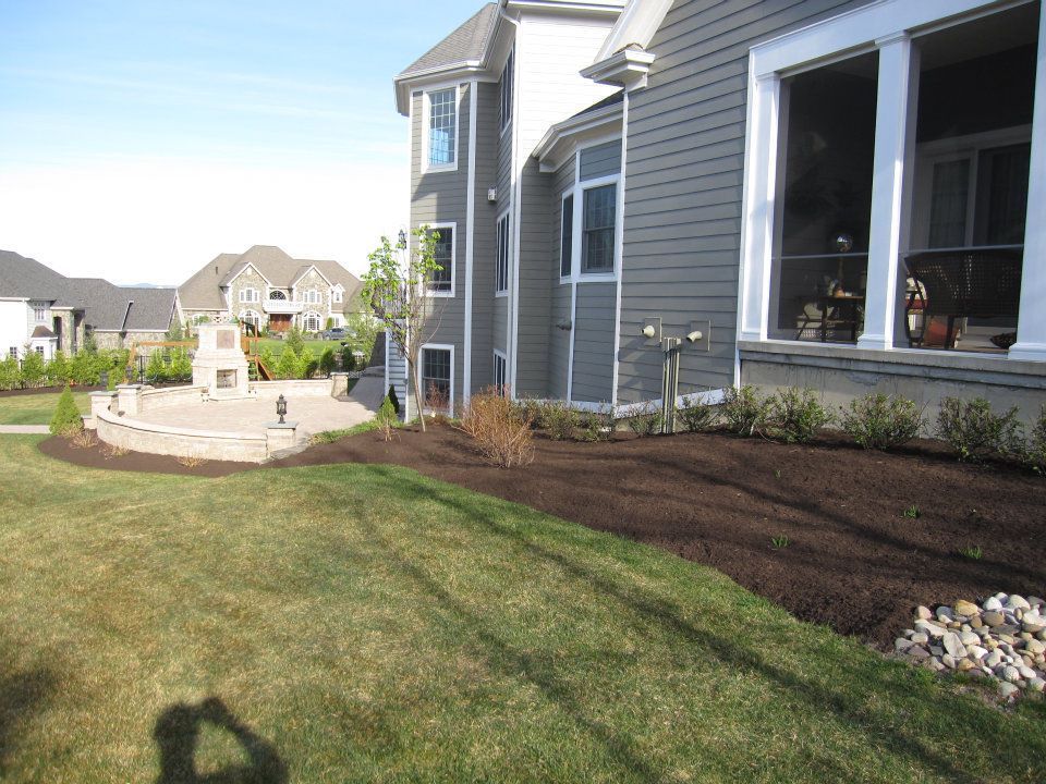 A large house with a large lawn in front of it