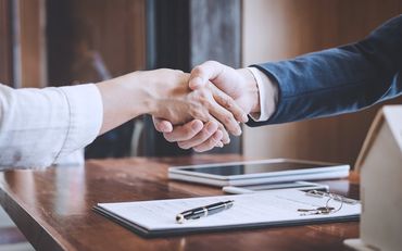 Client and attorney handshake