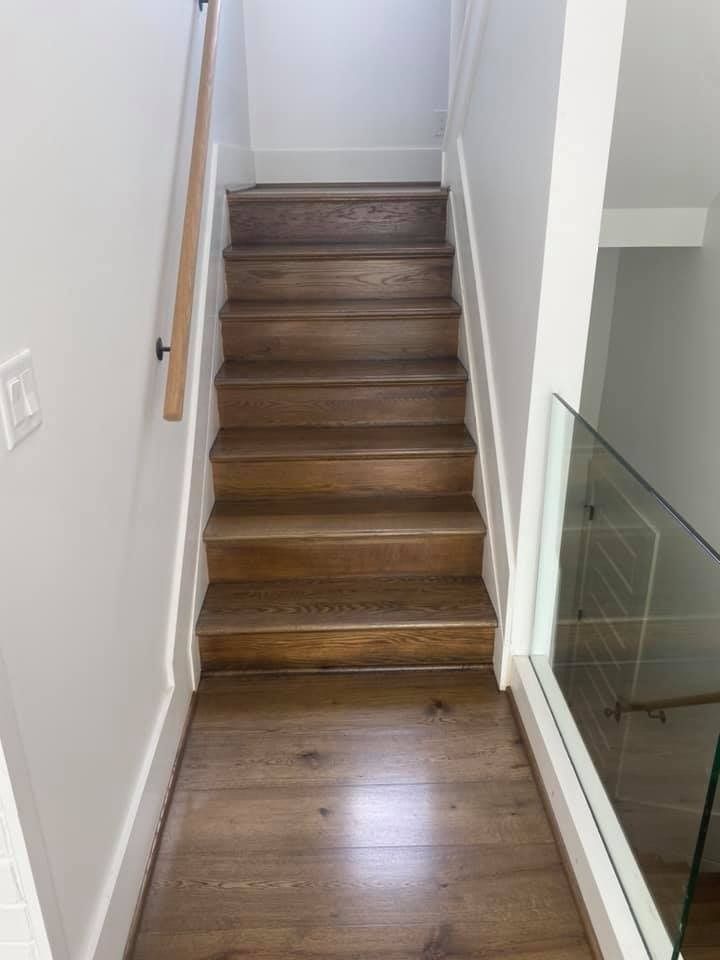 A wooden staircase leading up to the second floor of a house.