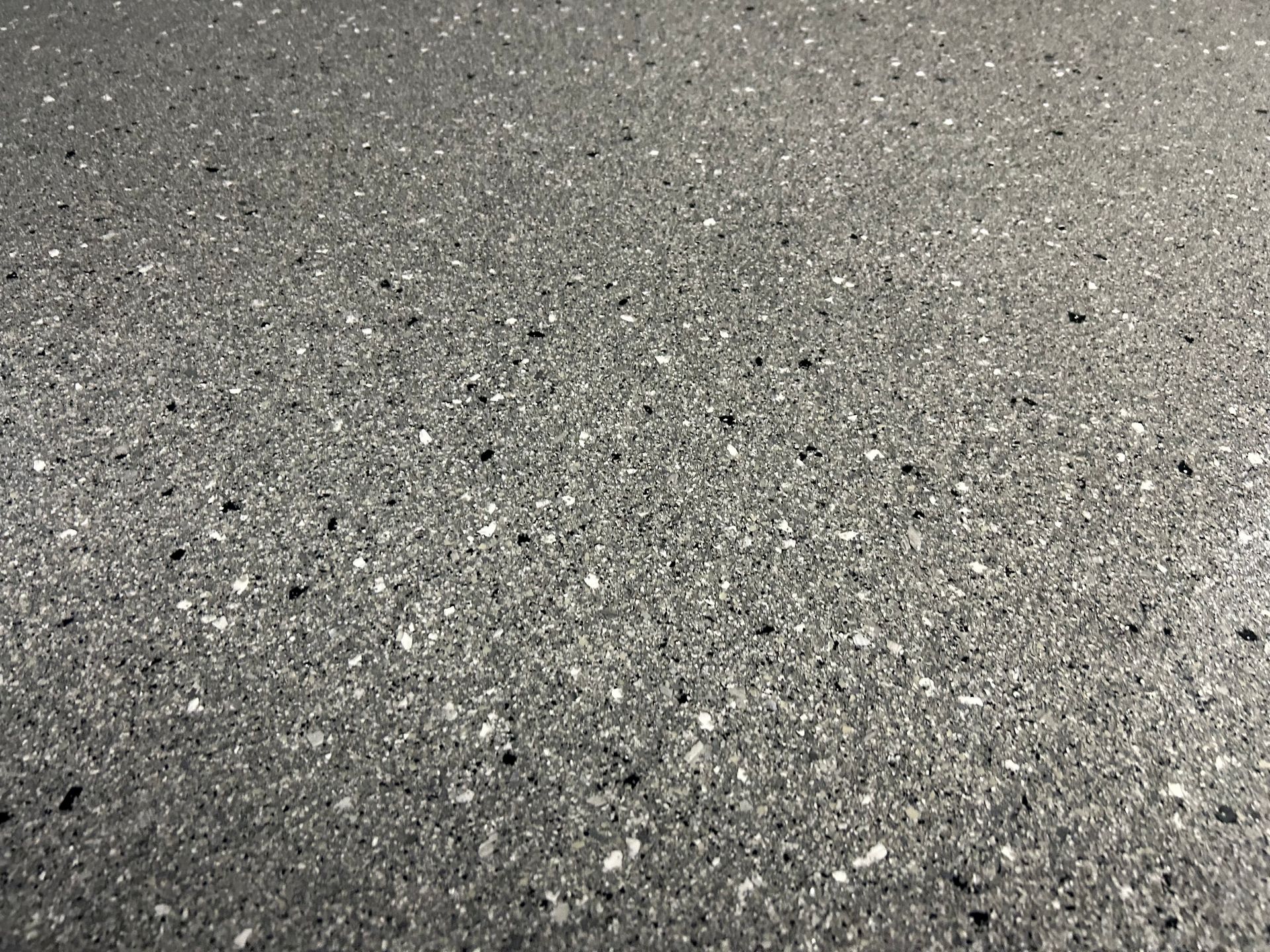 Gray speckled epoxy floor.
