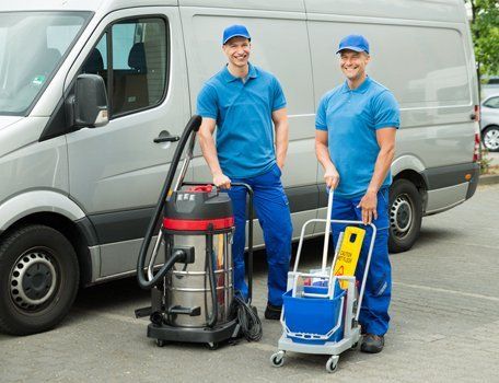 male cleaners smiling