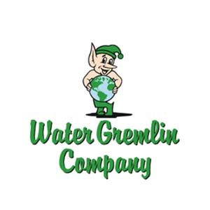 A logo for water gremlin company with an elf holding a globe