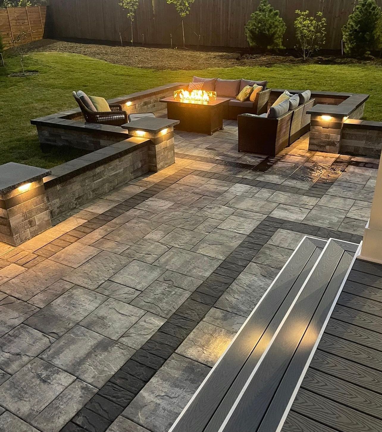 There is a fire pit in the middle of the patio.