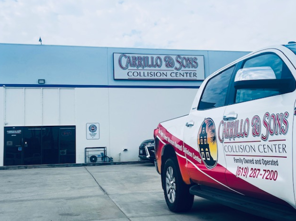 A Carrillo & Sons Collision Center truck is parked in front of the building