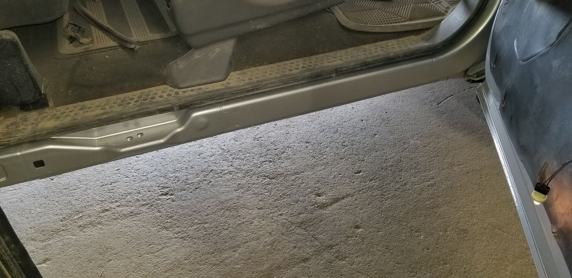 a person is standing in the doorway of a car