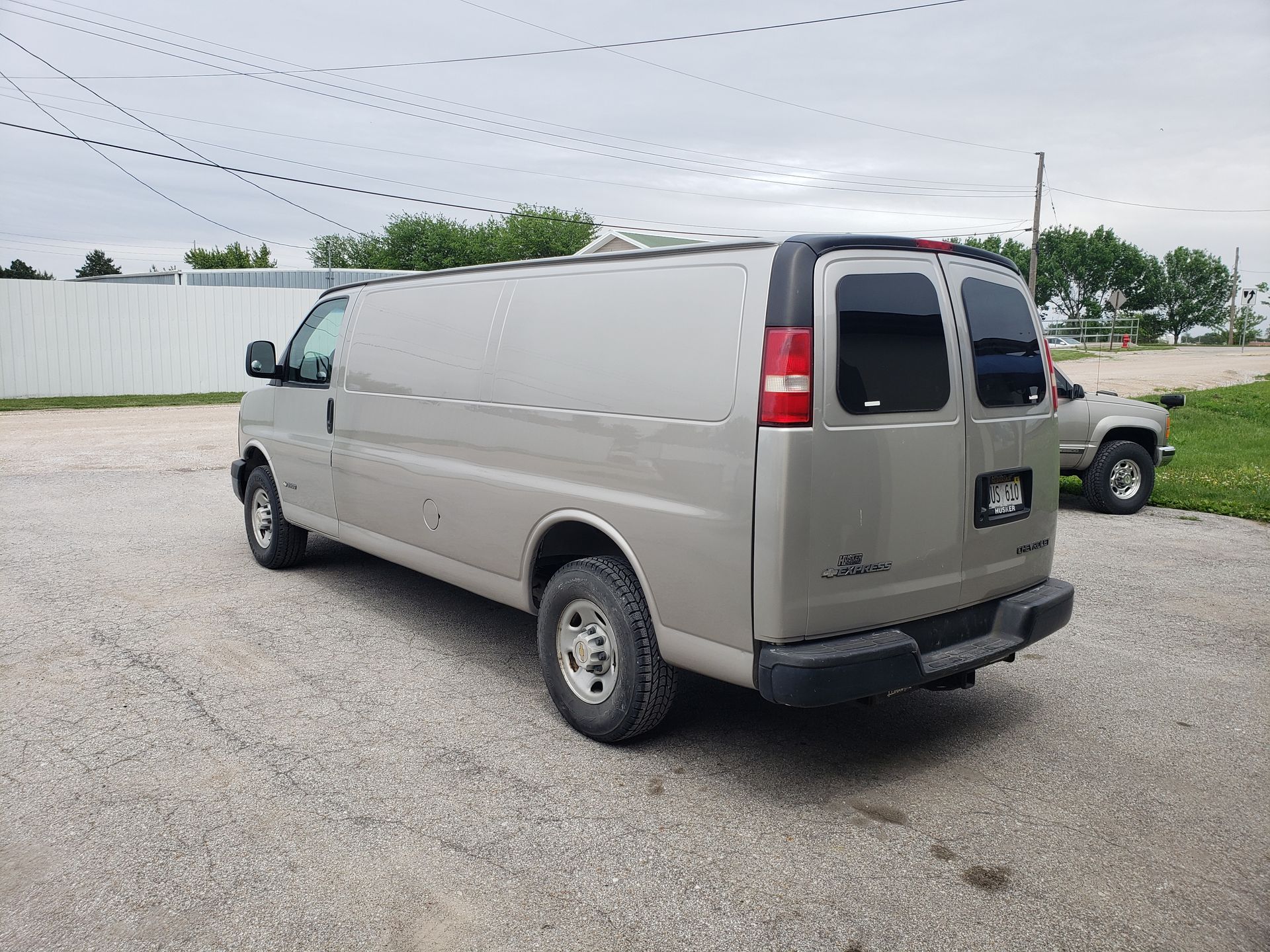 a silver van is parked in a parking lot