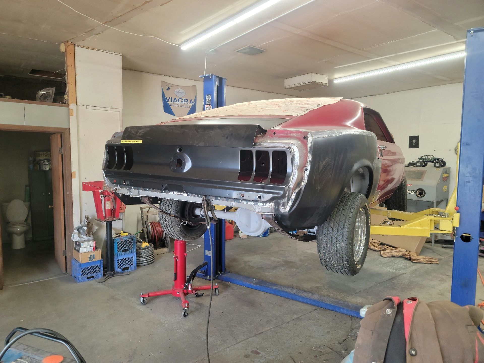 a car is sitting on a lift in a garage