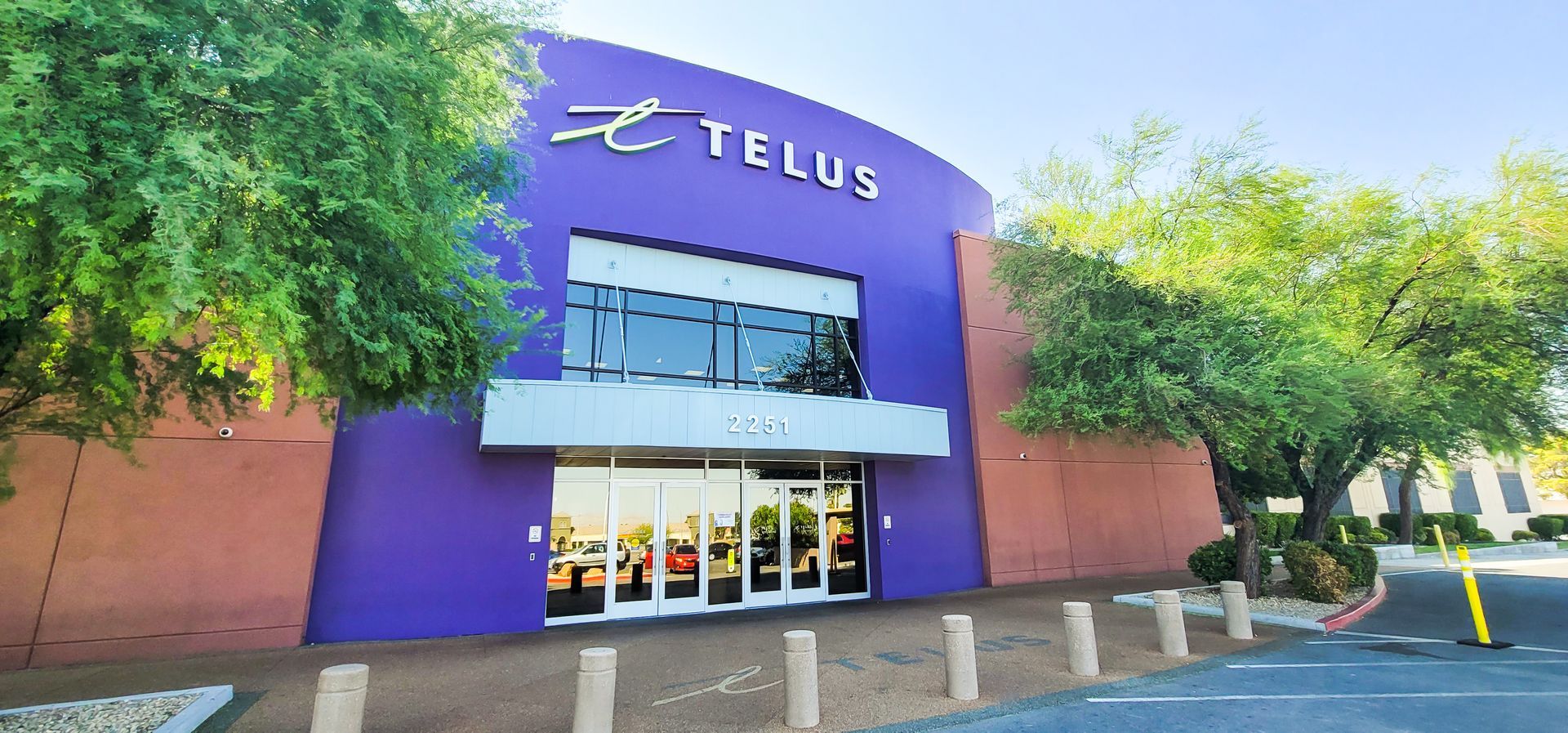 A purple building with the word telus on it