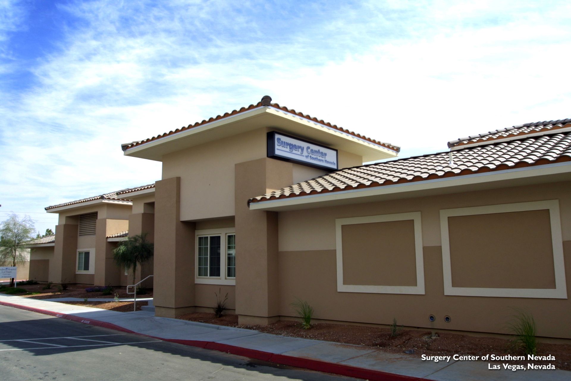 A building with a sign that says surgery center on it