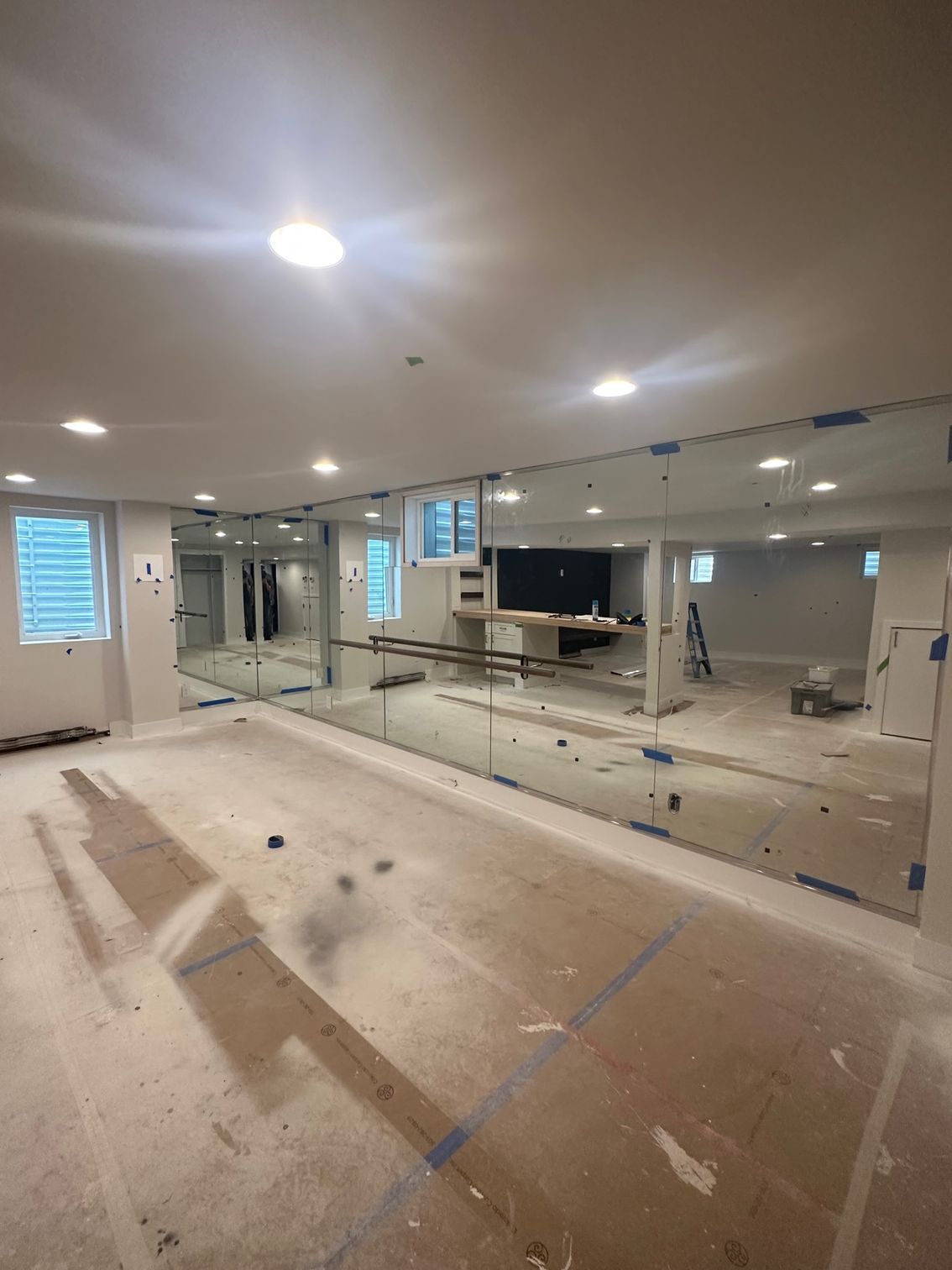 A large room with a lot of mirrors on the wall.