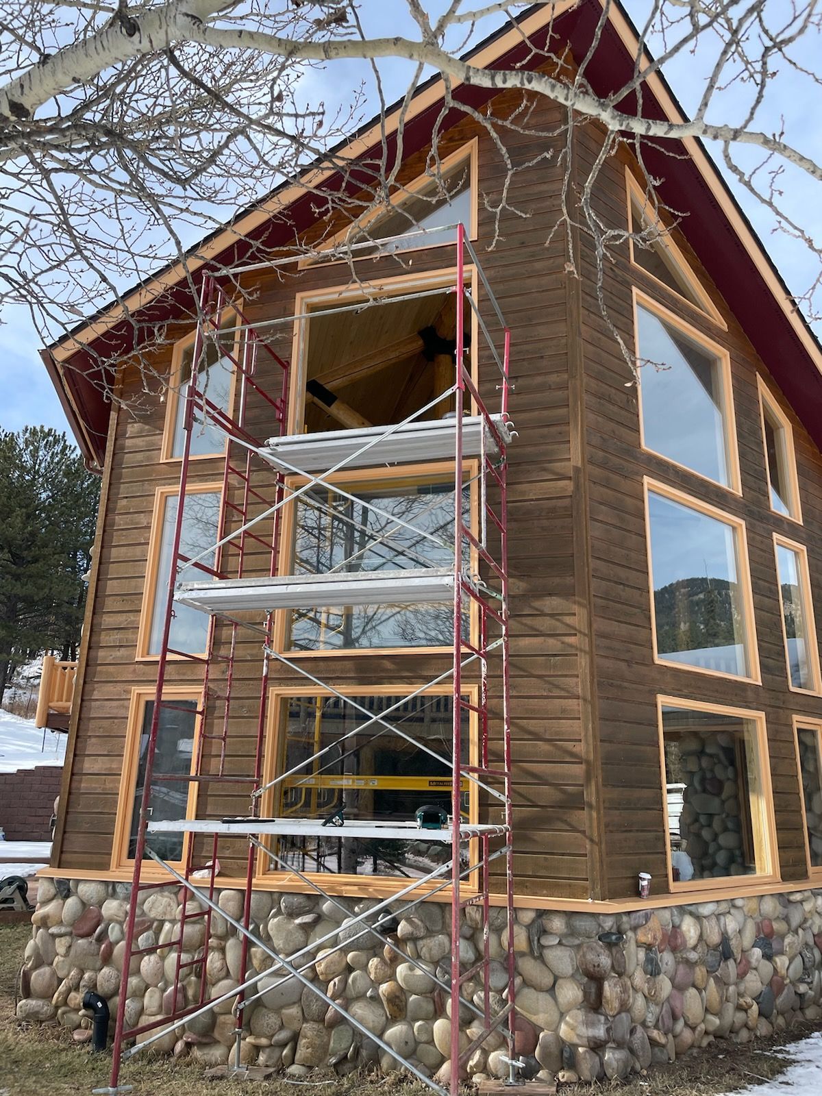 A large house with a lot of windows and scaffolding around it.