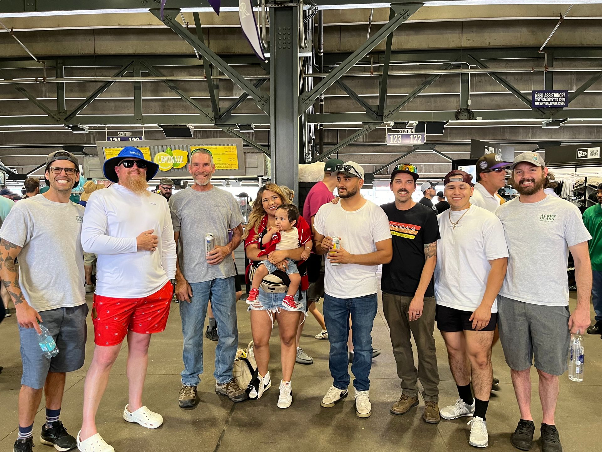 A group of people standing next to each other in a room.