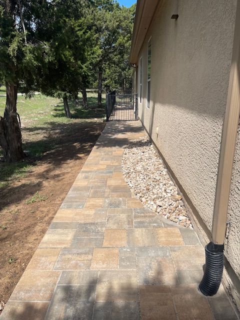 A sidewalk is being built in front of a house.