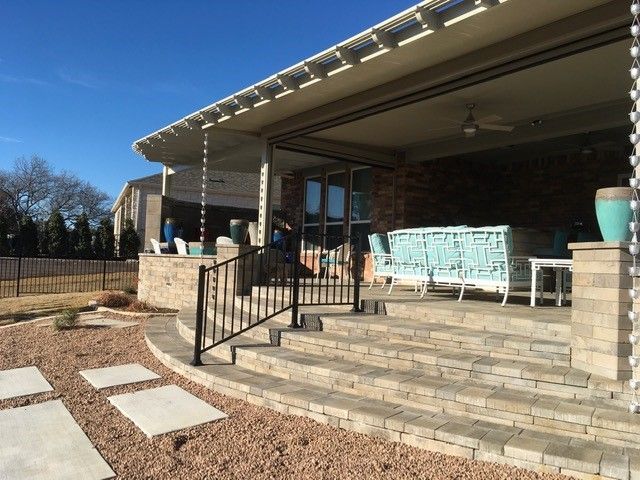 A house with a porch and stairs leading up to it