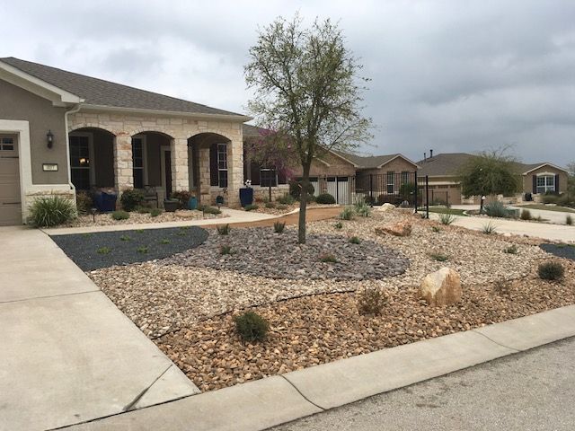 A house with a lot of rocks in front of it