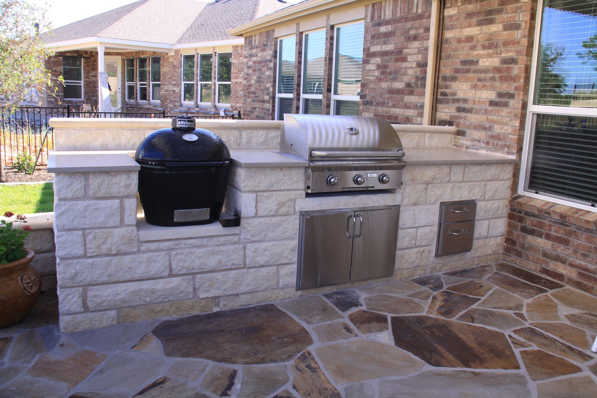 A grill is built into the side of a brick building