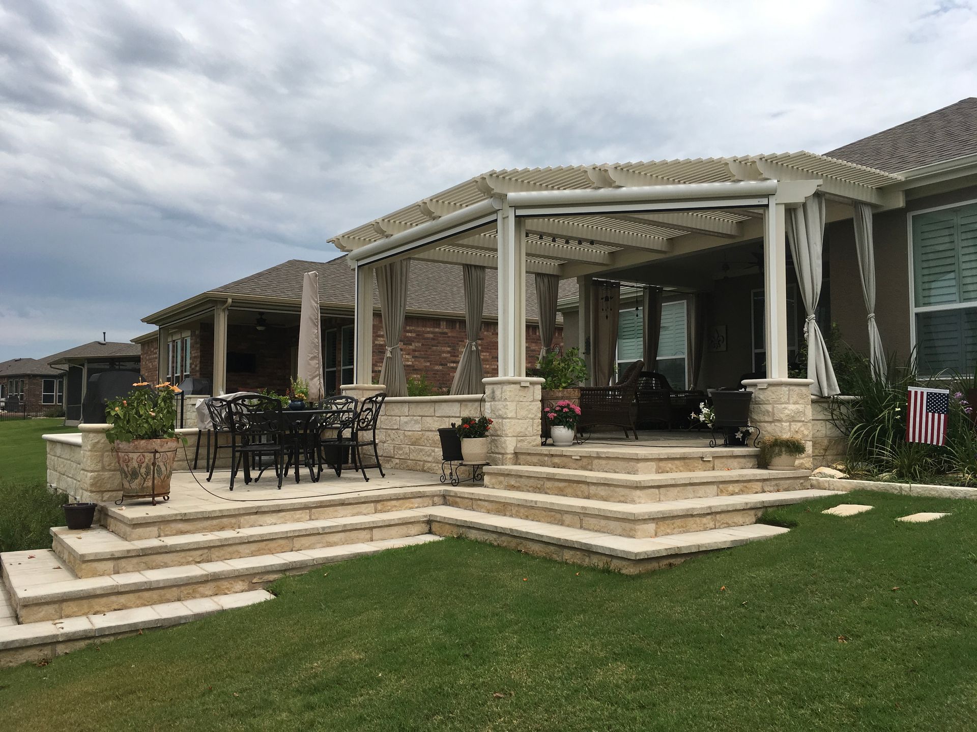 A house with a patio and stairs in front of it