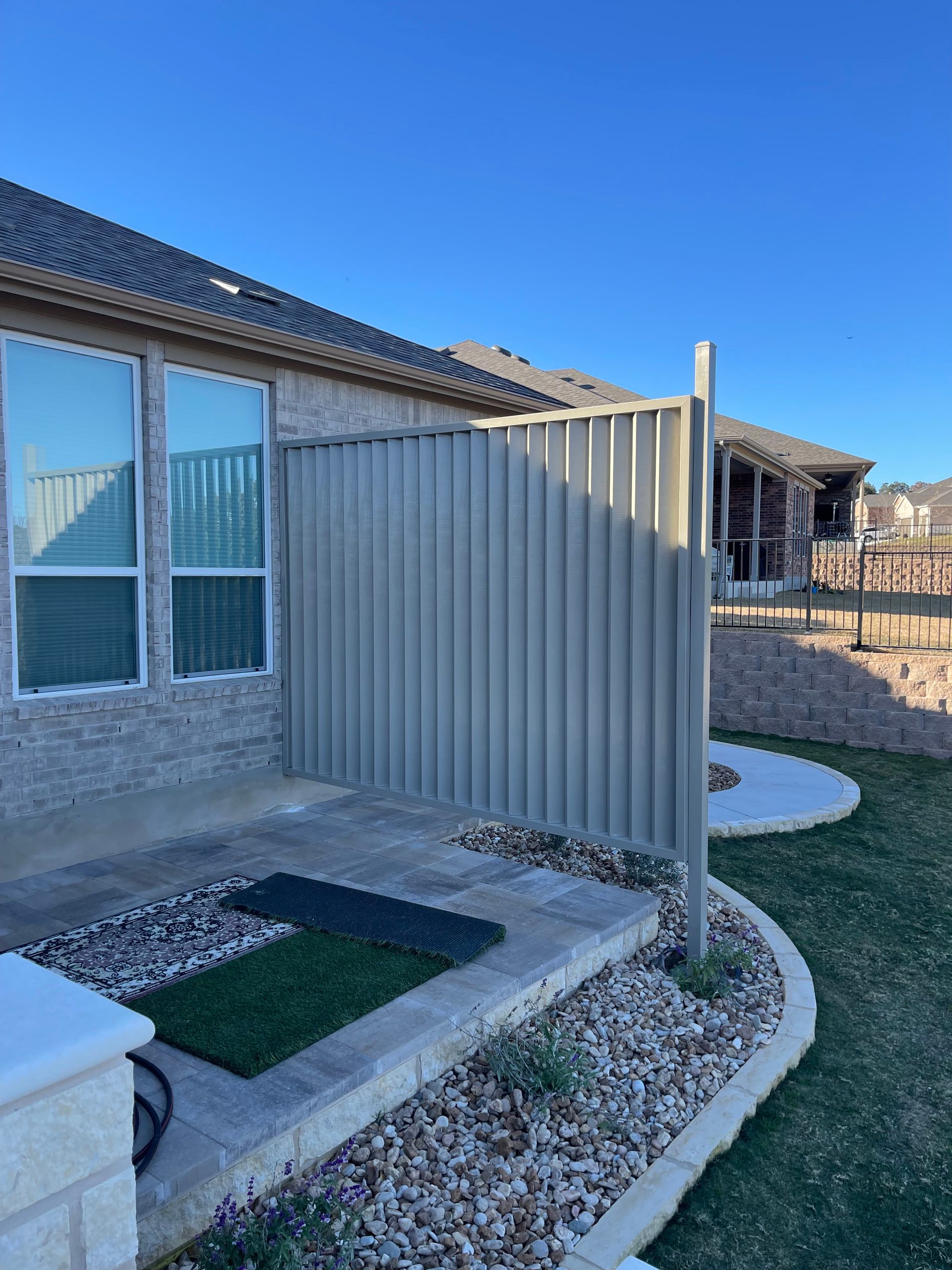 A house with a fence in front of it