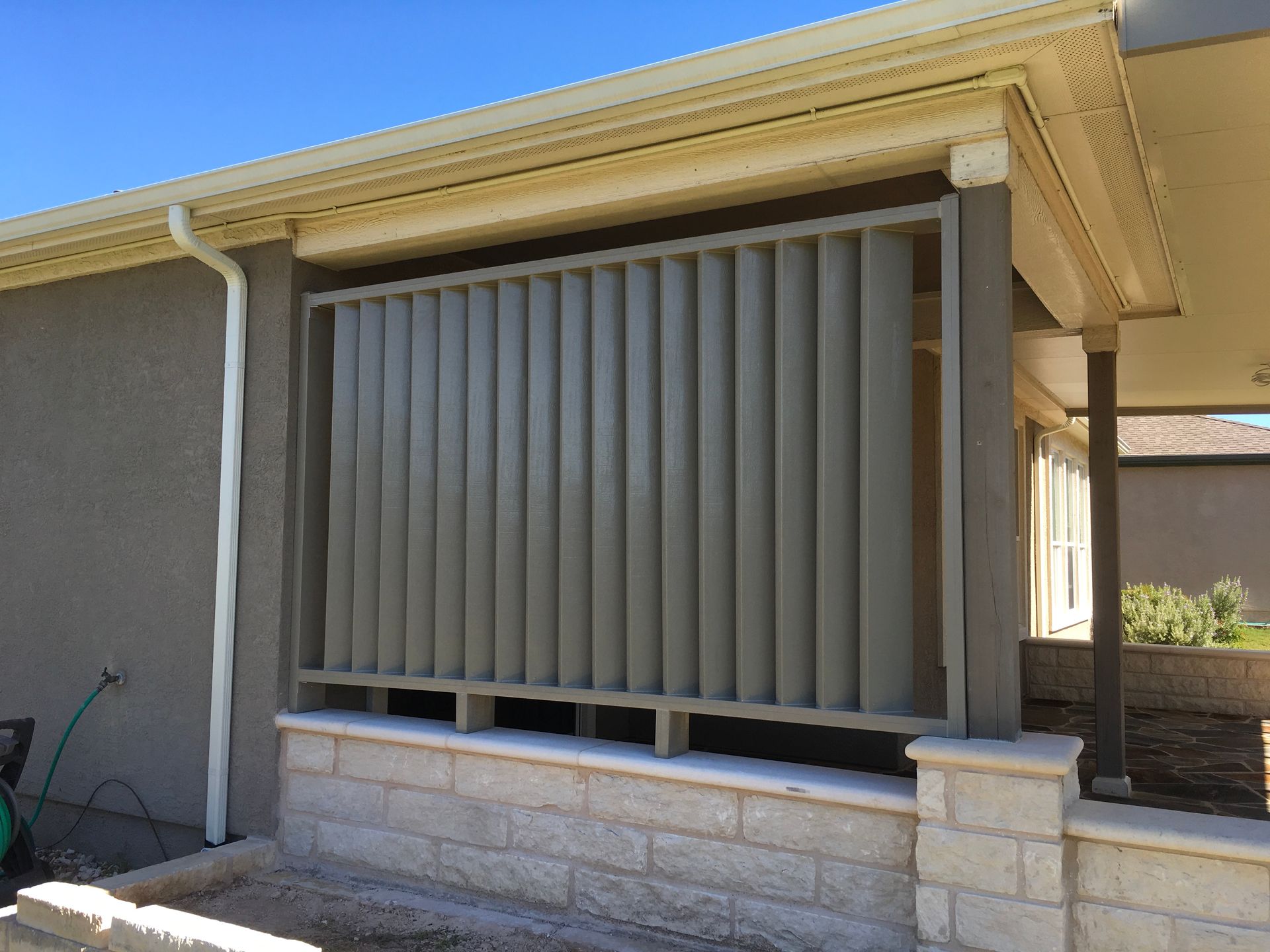 A house with a fence on the side of it