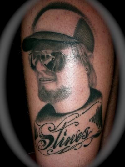 A tattoo of a man with the name stings on his arm