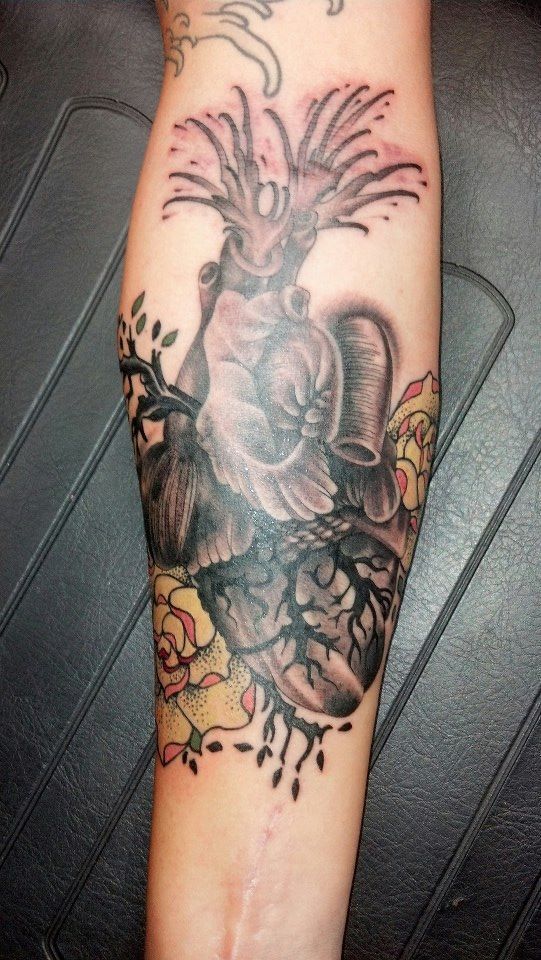 A person has a tattoo of a bird on their arm.