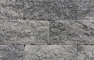 A close-up of a gray stone wall