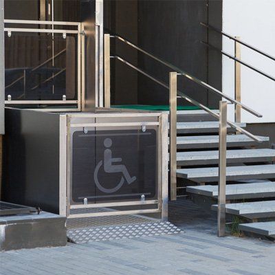 A staircase with a handicap sign on it