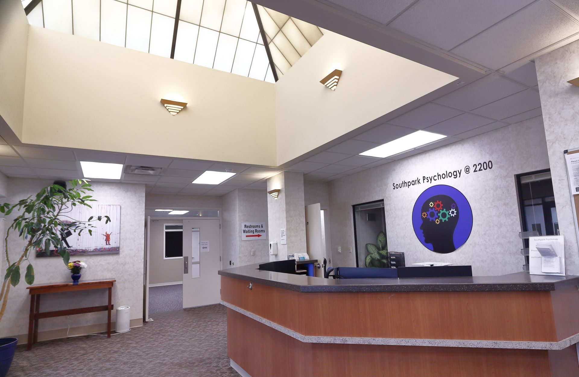 A reception area with a sign on the wall that says ' psychology '