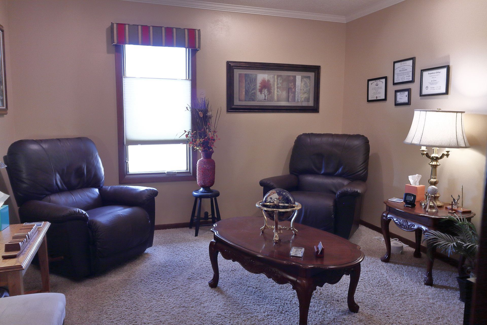 A living room with two chairs and a coffee table. - Dale