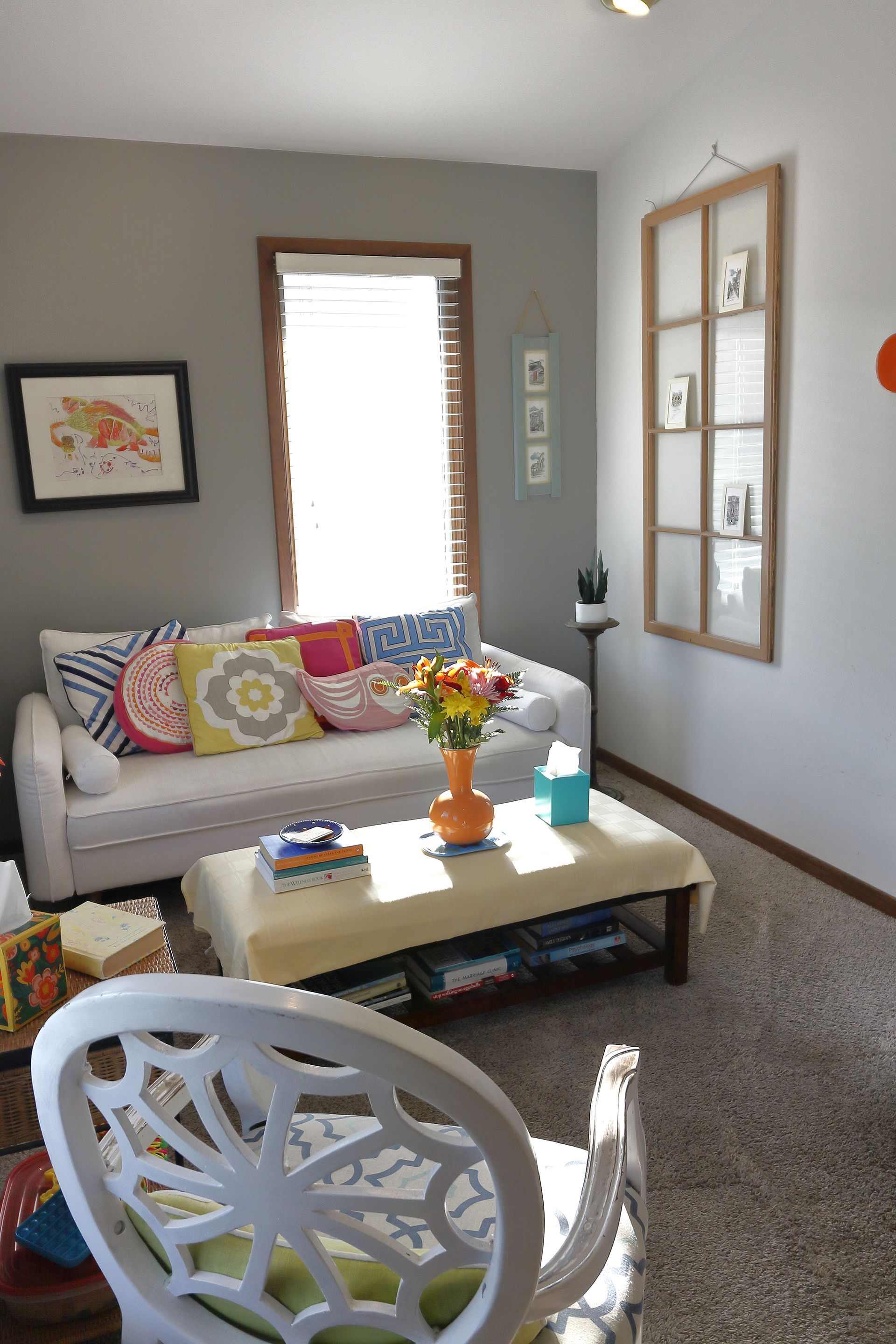 A living room with a couch and a coffee table. - Debbie