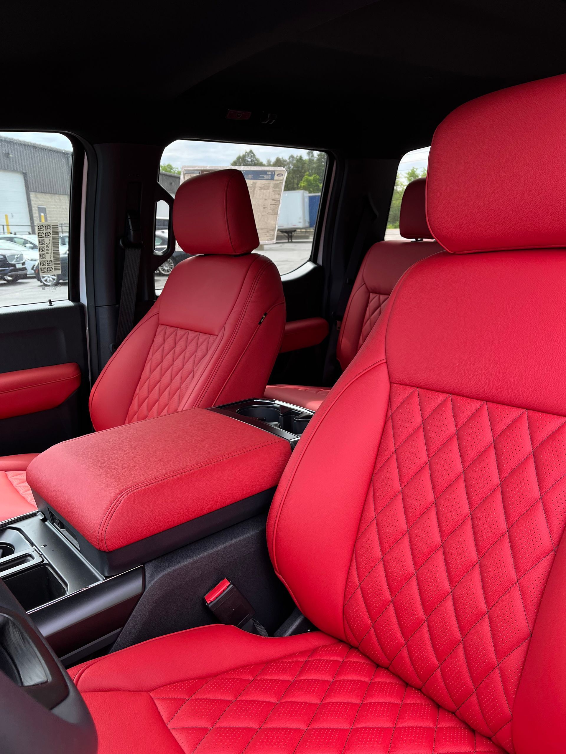 Red quilted leather car seats and center console interior