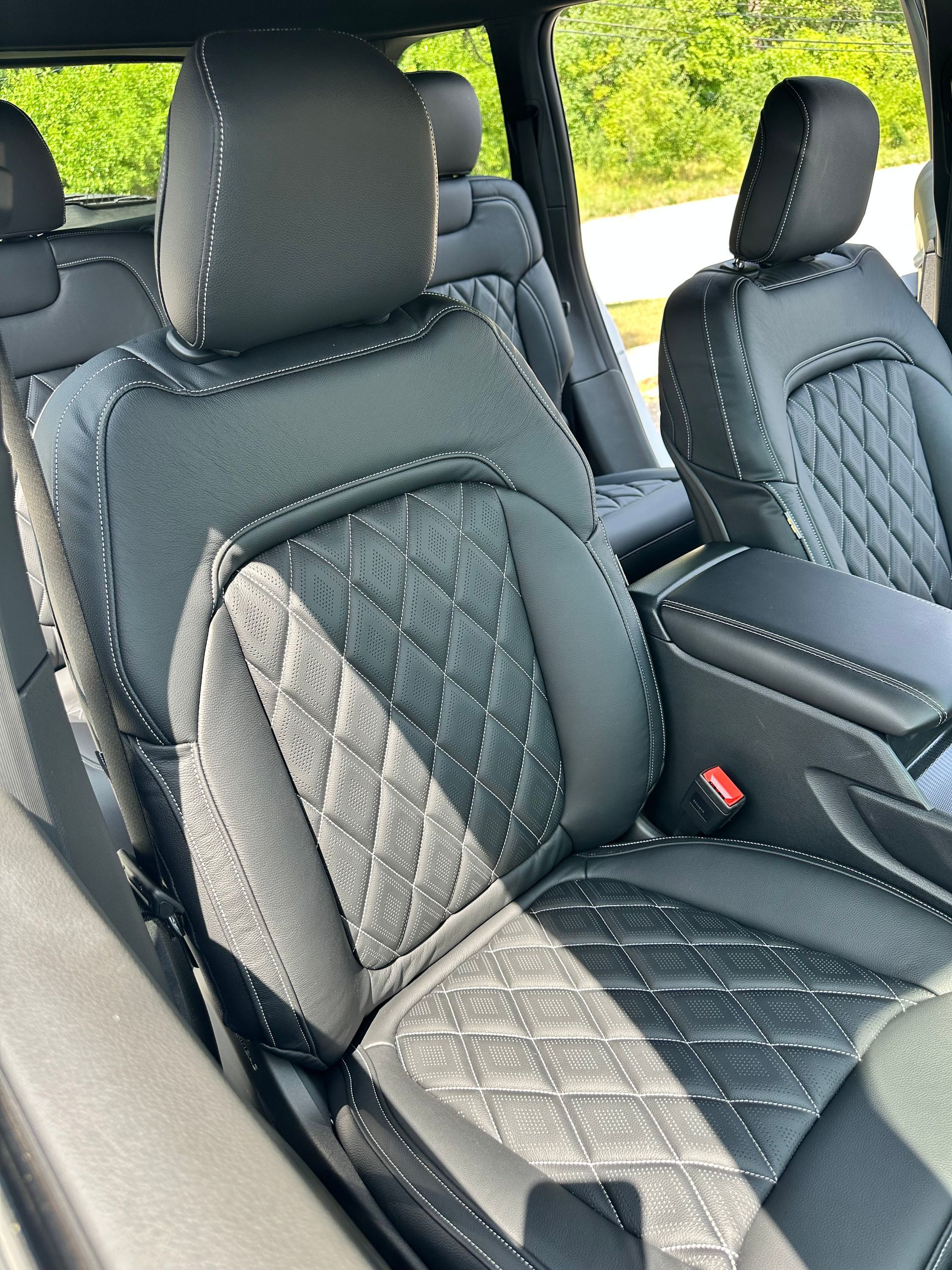 Quilted car seats with headrests inside a vehicle interior