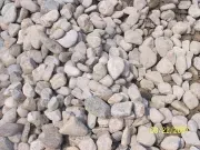 A pile of white gravel is sitting on the ground.