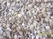 A pile of gravel is sitting on the ground.