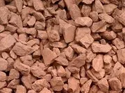 A pile of brown rocks on a white background.