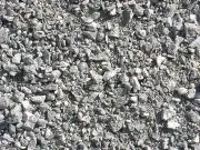 A pile of gravel is sitting on the ground.