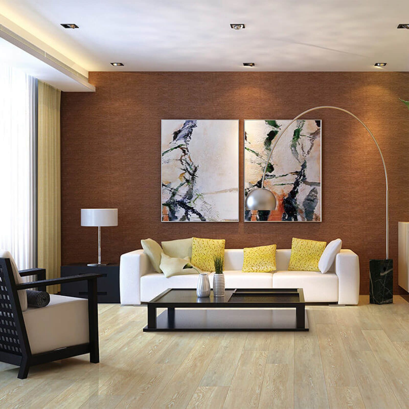 Modern living room with white sofa, black coffee table, artwork, and light wood flooring.