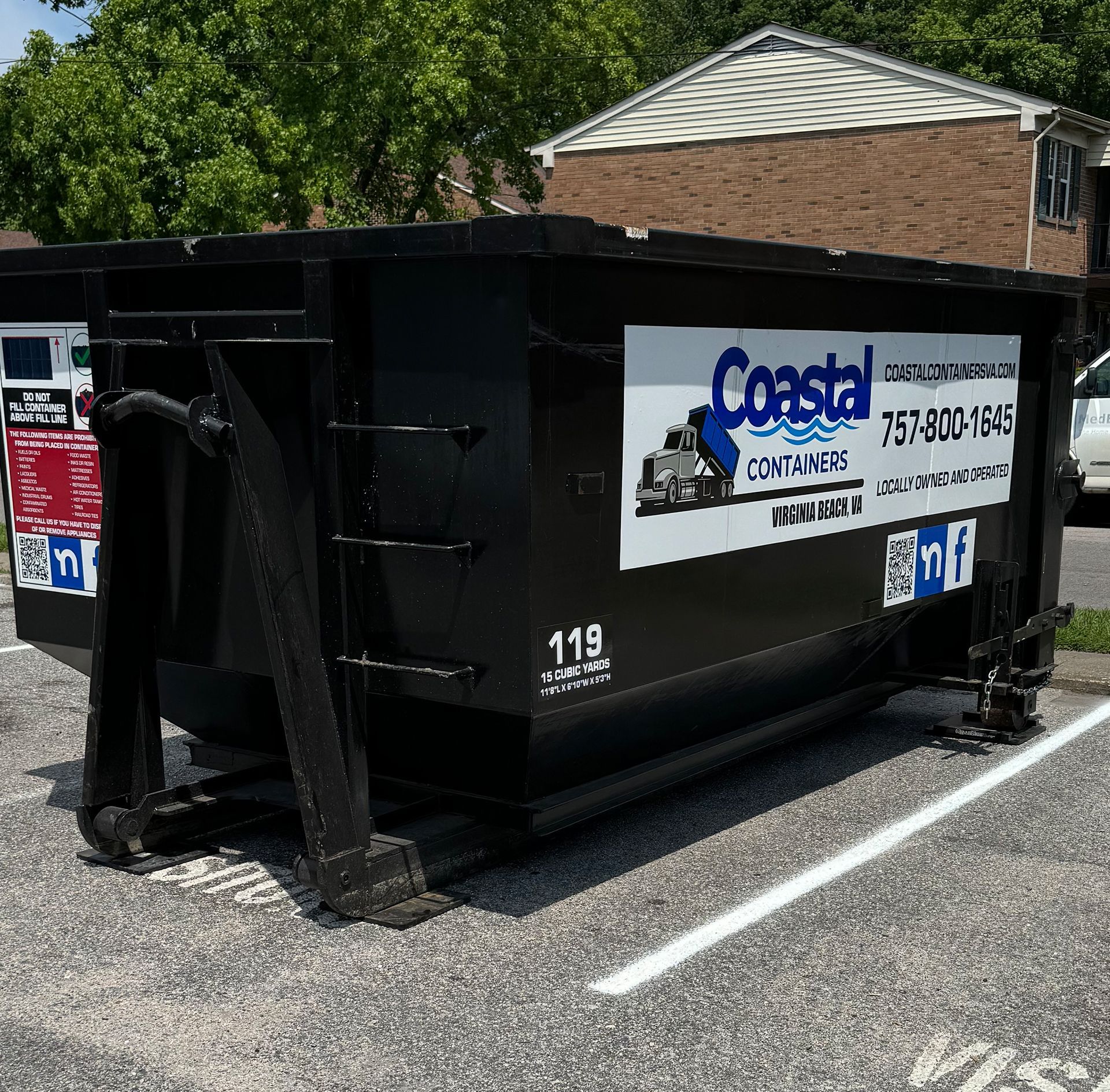 A dumpster with the word coastal on it