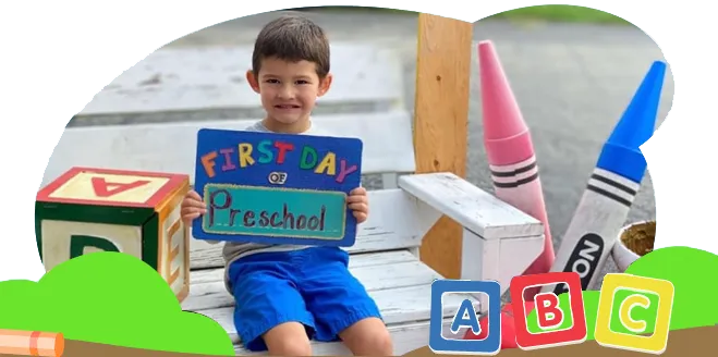 a young boy is holding a sign that says first day of preschool