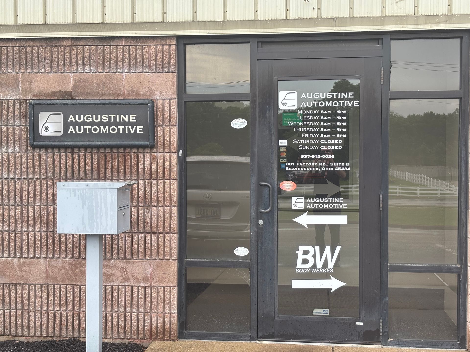 A building with a sign that says augustine automotive