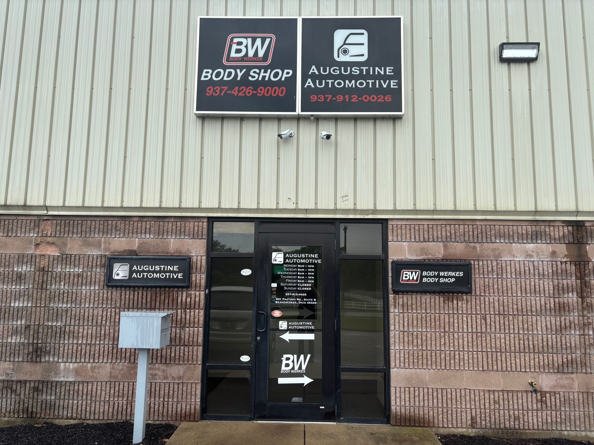 A building with a sign that says bw body shop