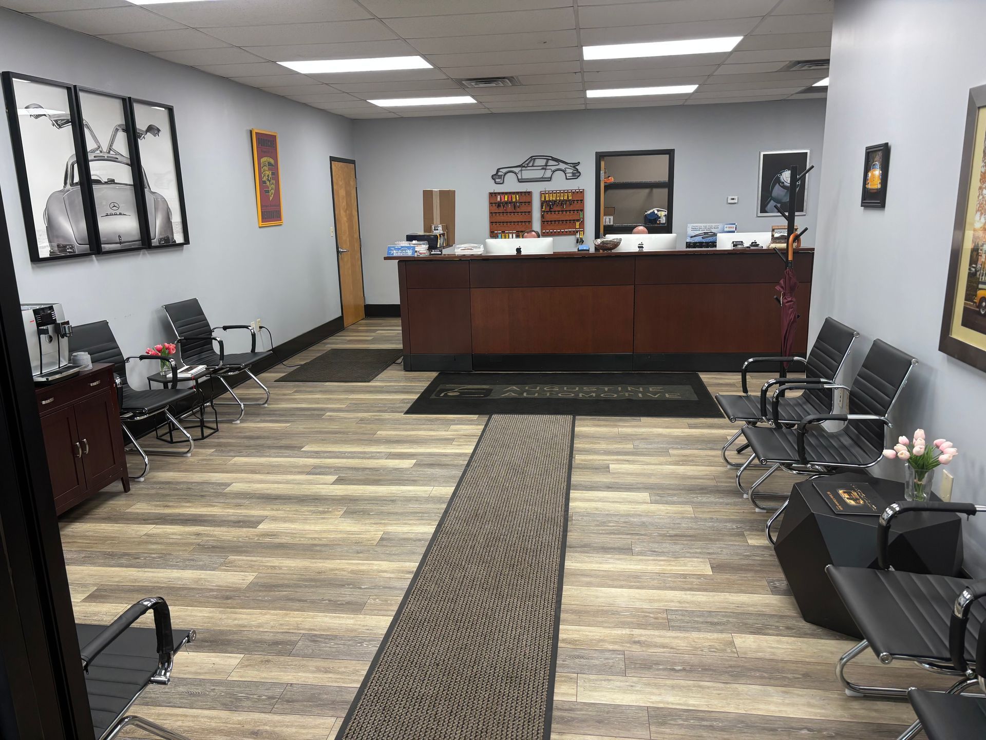 A waiting room with chairs and a counter in a building.