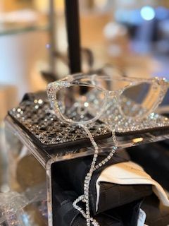 A pair of glasses is sitting on top of a table.