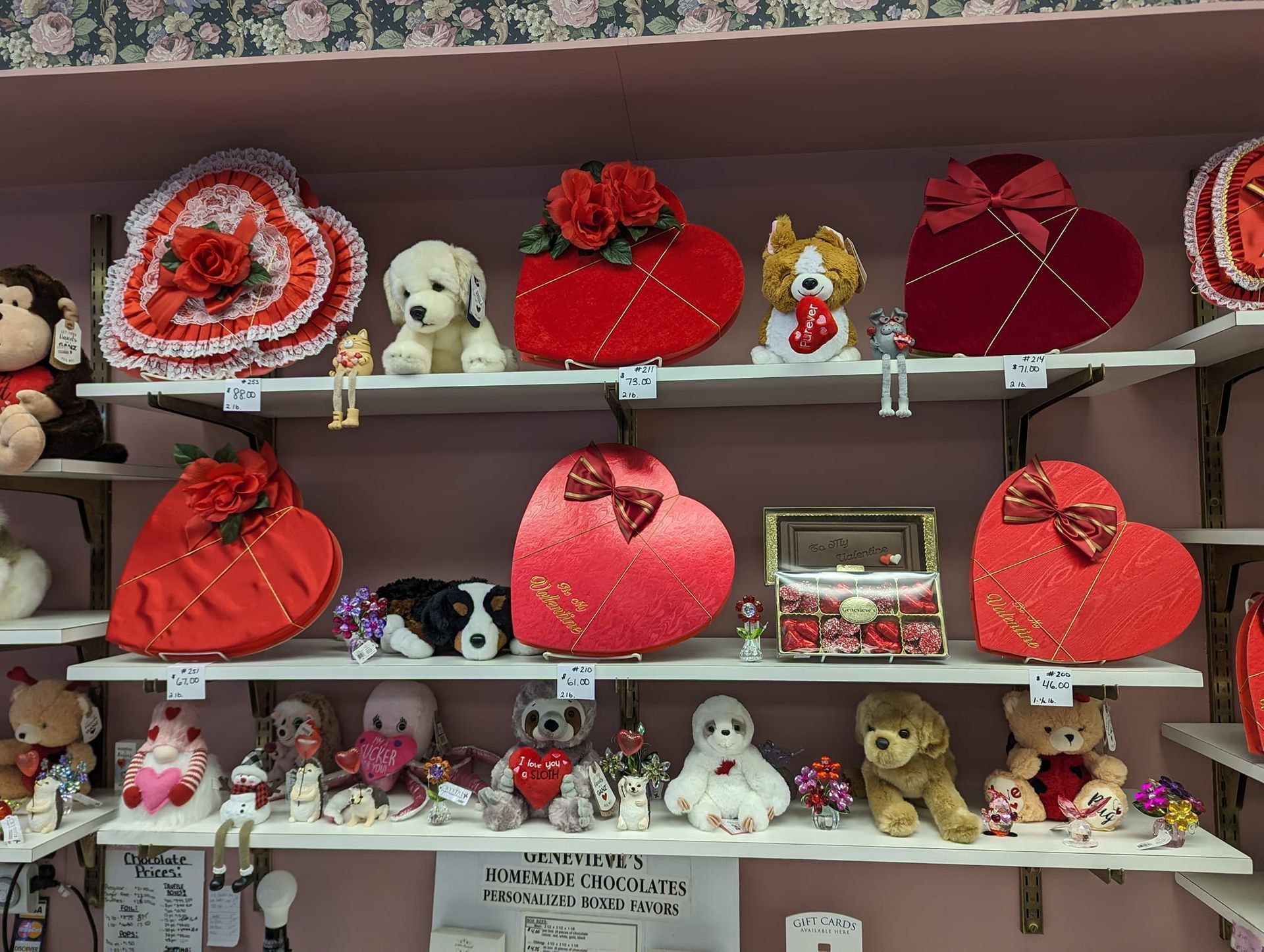 A shelf full of stuffed animals and valentine 's day gifts