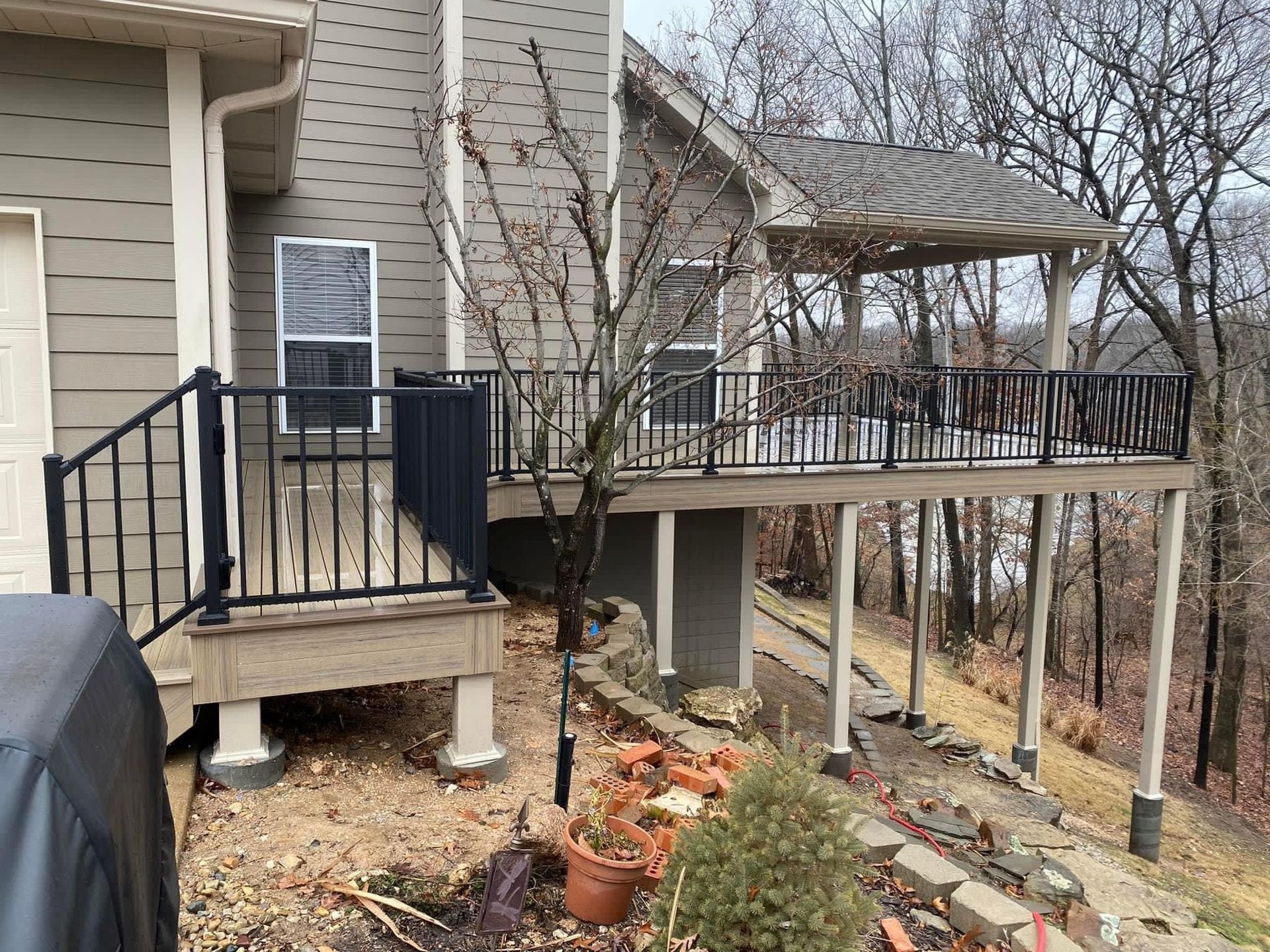 a house with a large deck and a covered porch