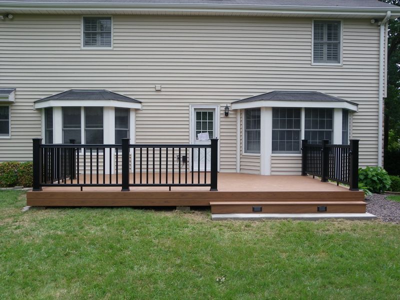 a house with a large deck in front of it