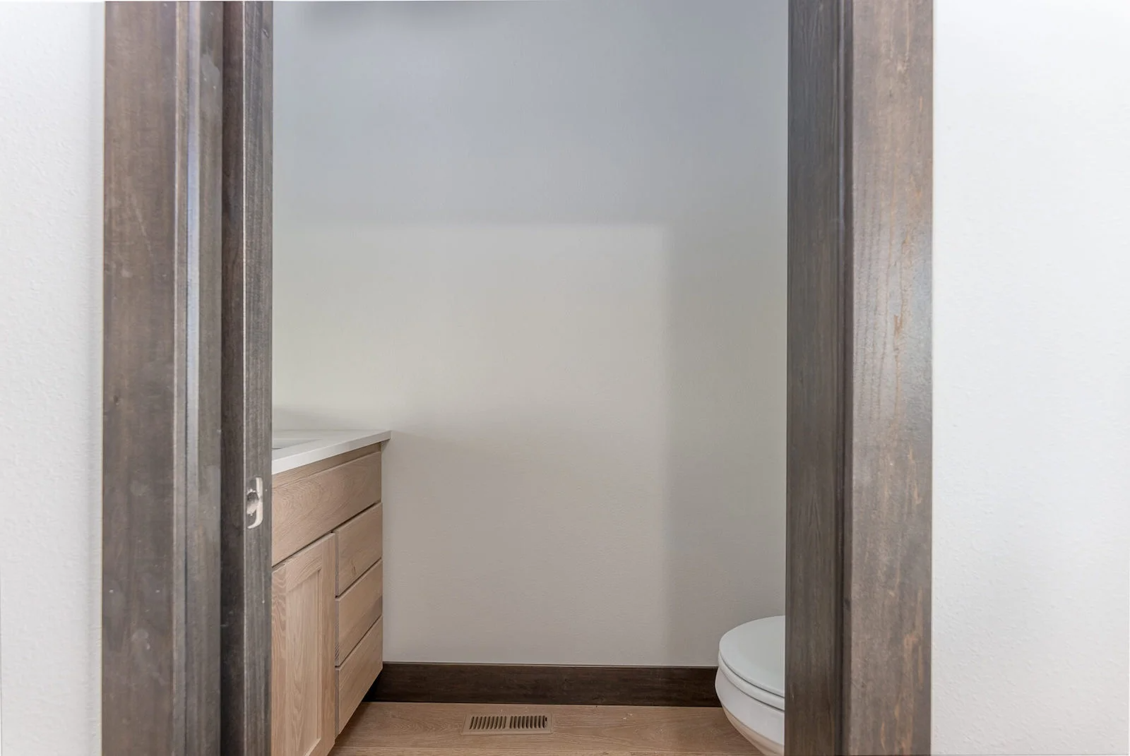 A bathroom with a toilet and a sink in it.