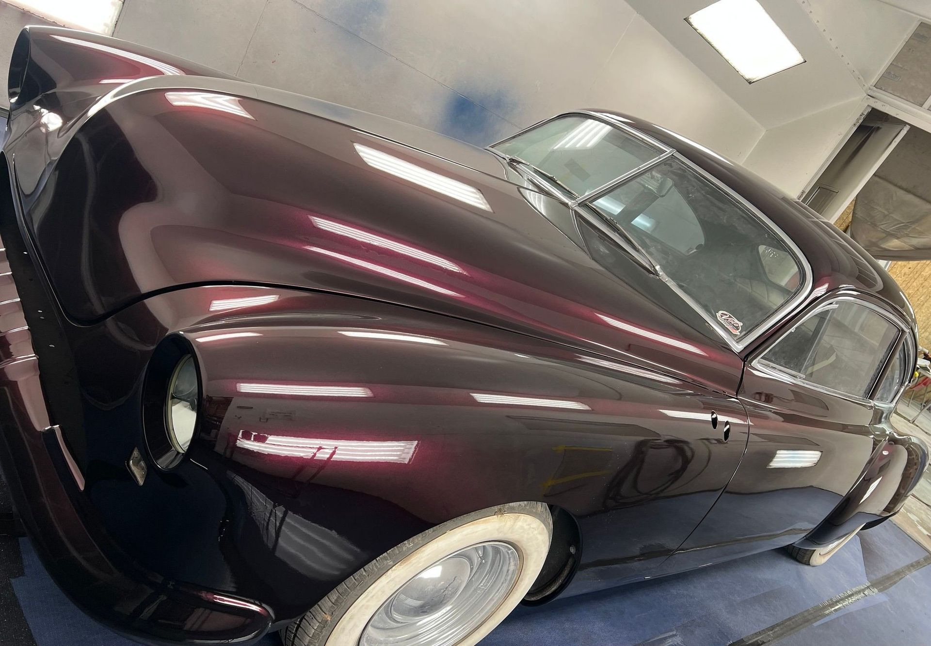 A purple car with white tires