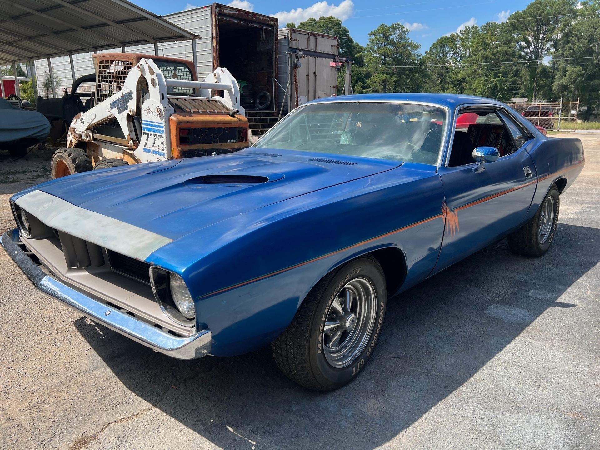 1973 Plymouth Barracuda, featuring a classic design and eye-catching details.